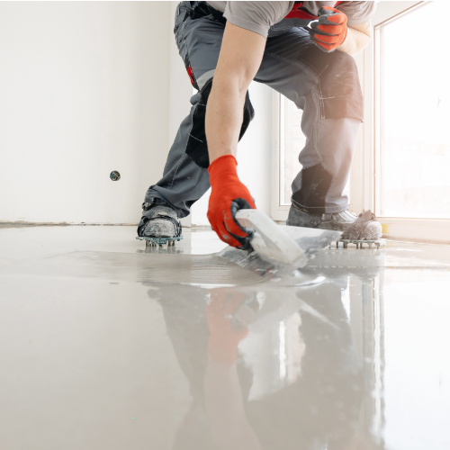Flooring & Renders man smoothing concrete floor